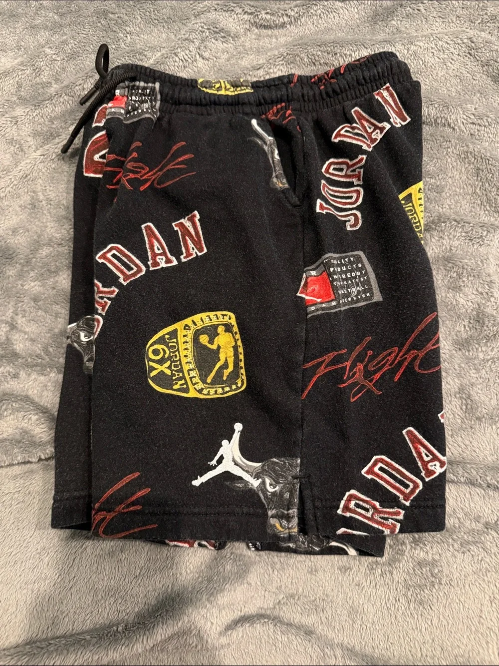 Jordan Black Graphic Logo Athletic Shorts with Red & Yellow Accents